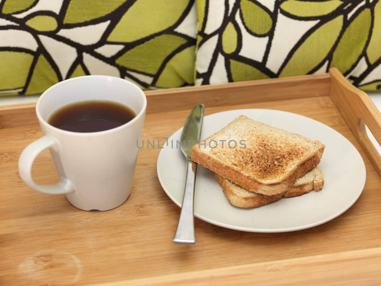 A close up shot of a wooden breakfast tray