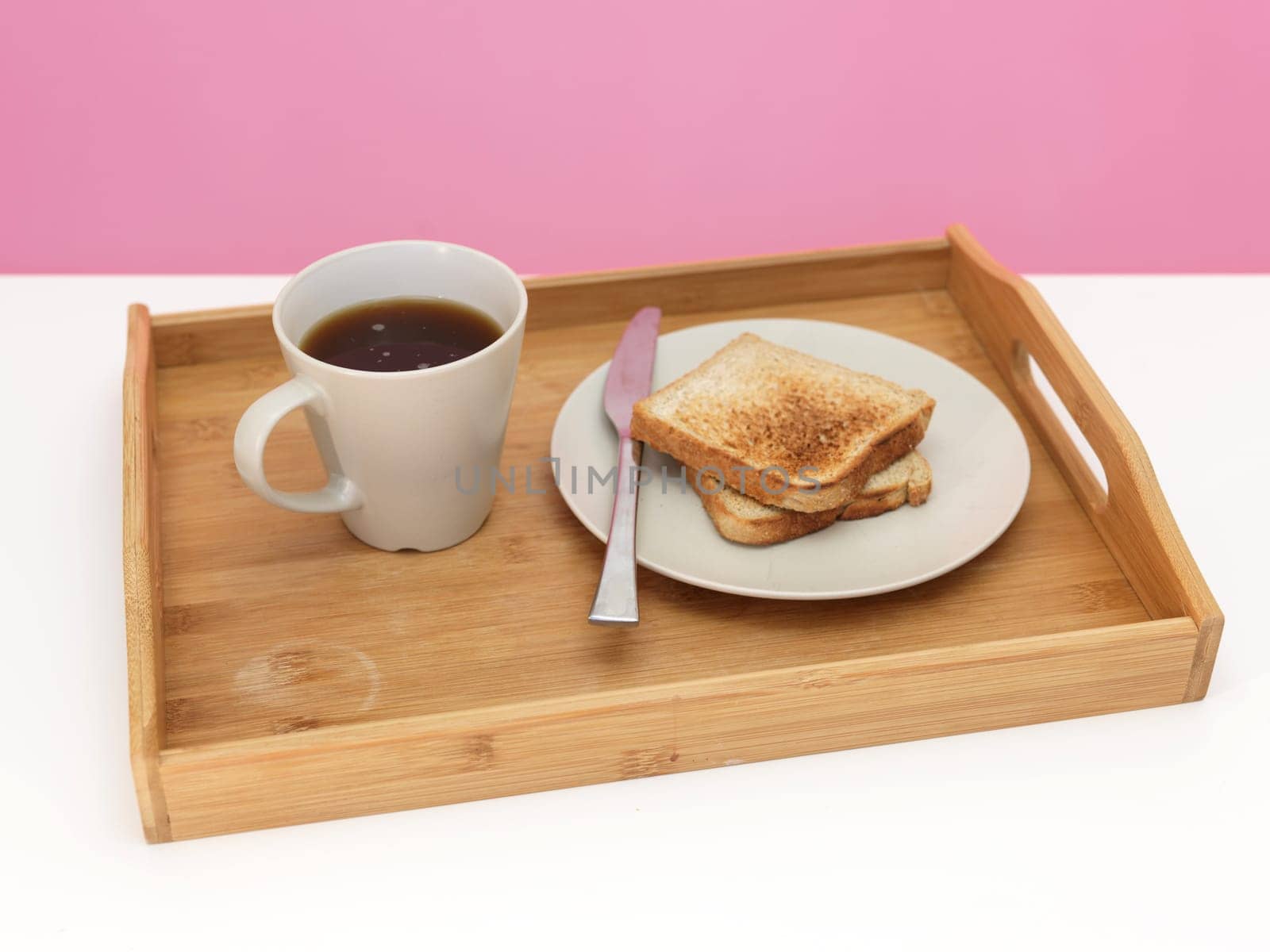 A close up shot of a wooden breakfast tray