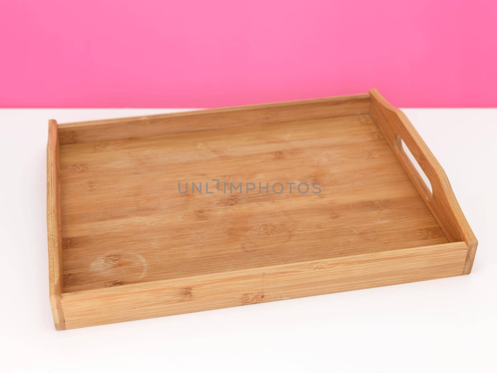 A close up shot of a wooden breakfast tray