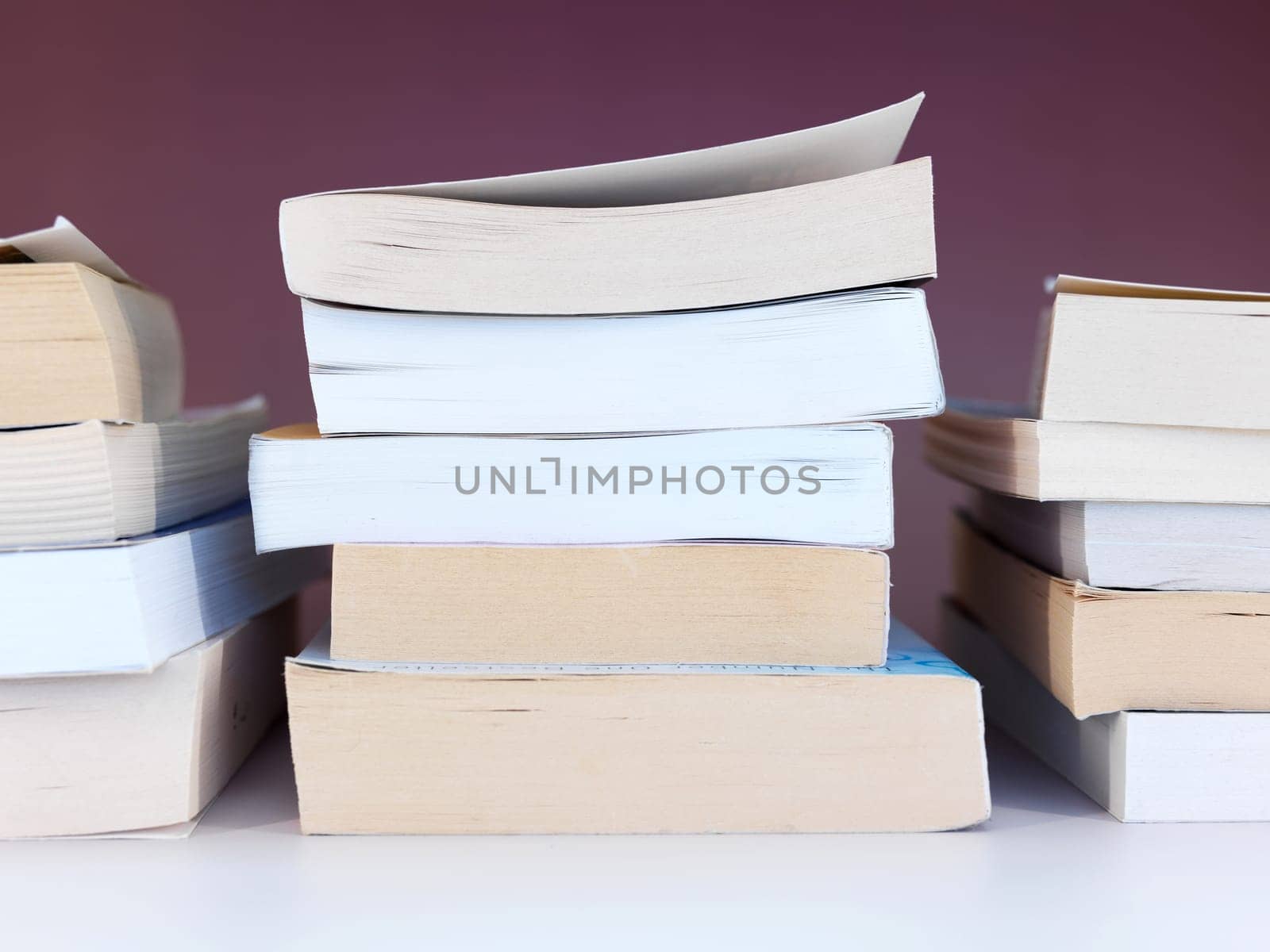 A close up shot of a pile of books