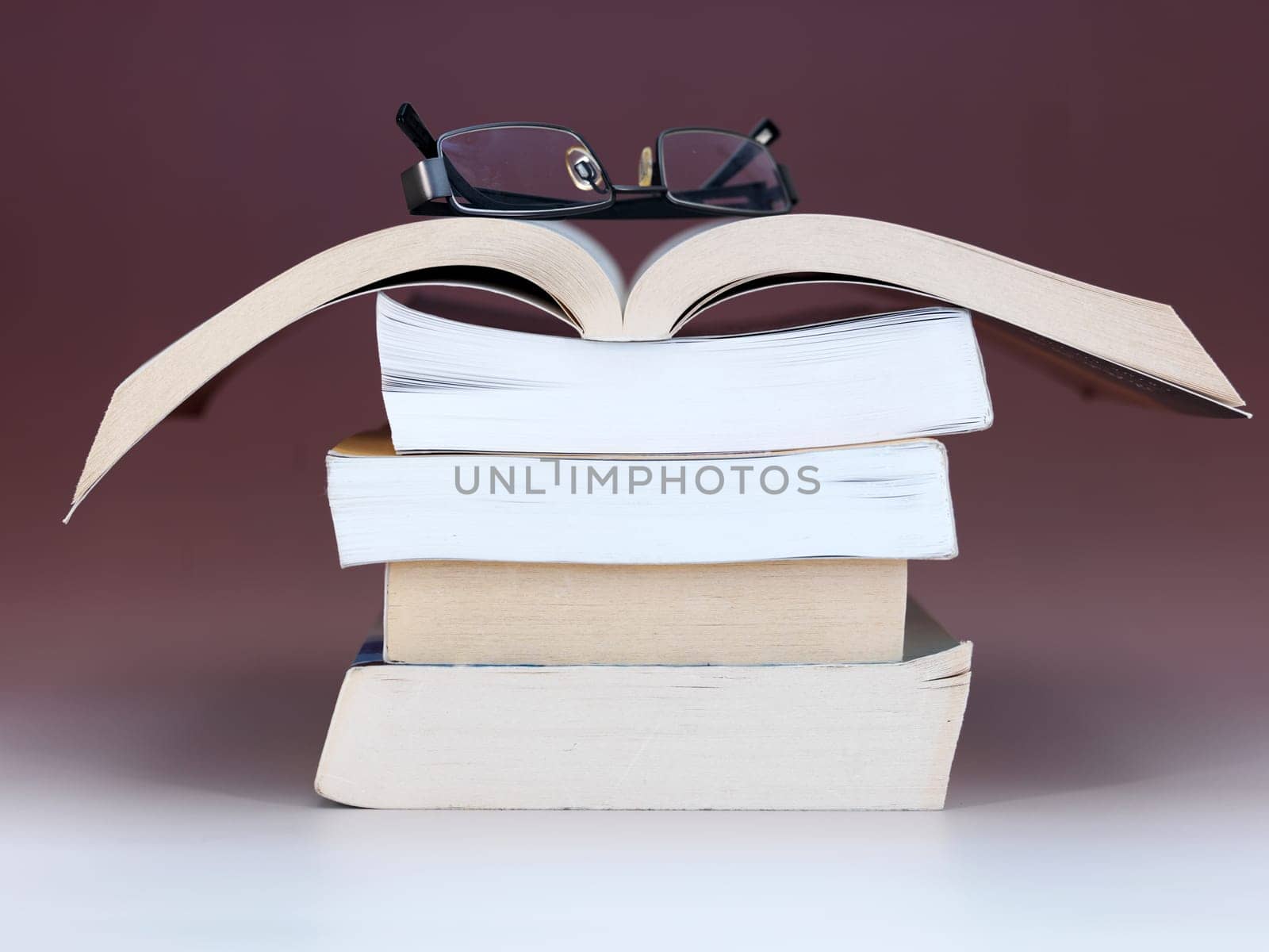A close up shot of a pile of books