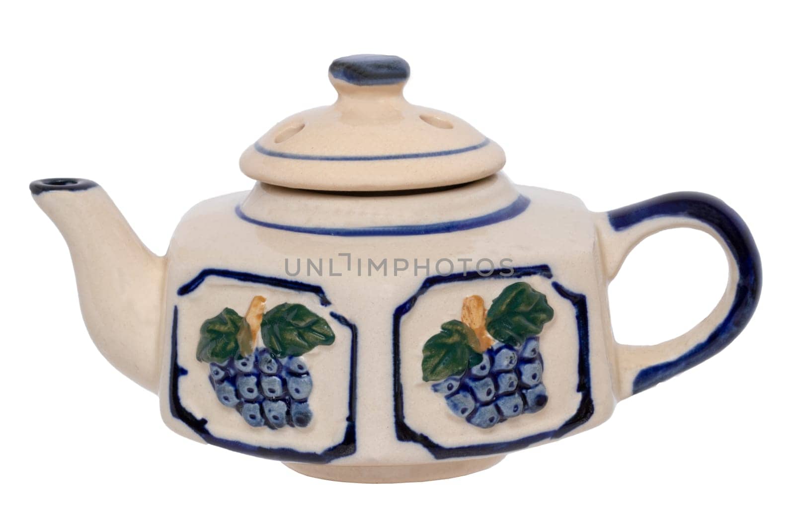 Teapot isolated. Close-up of a vintage colorful blue white tea pot made of ceramic pottery isolated on a white background. Macro photograph.