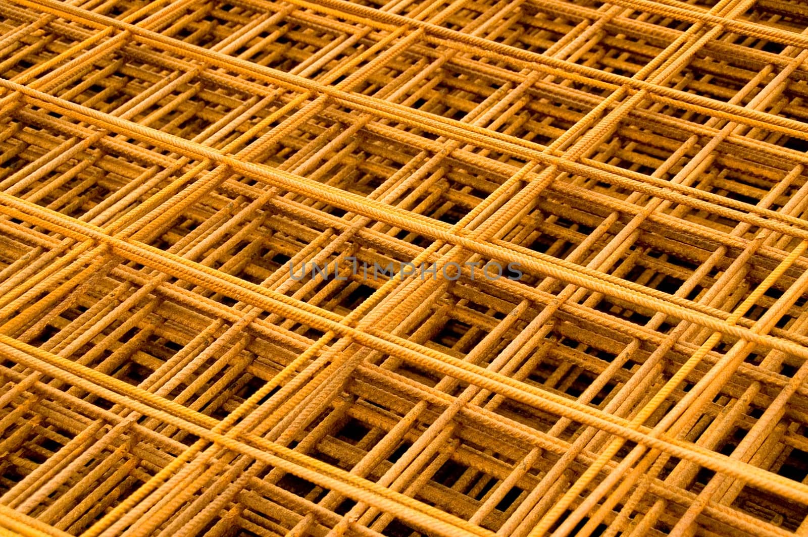 A stack of russet reinforcement steel mats. With space for copy.