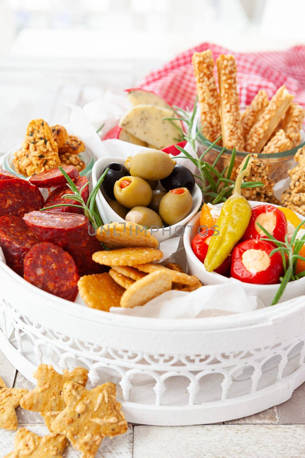 Colorful antipasti, cheese and savoury crackers for Christmas