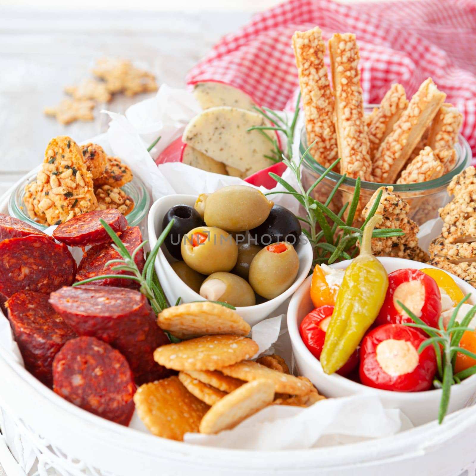 Colorful antipasti, cheese and savoury crackers for Christmas