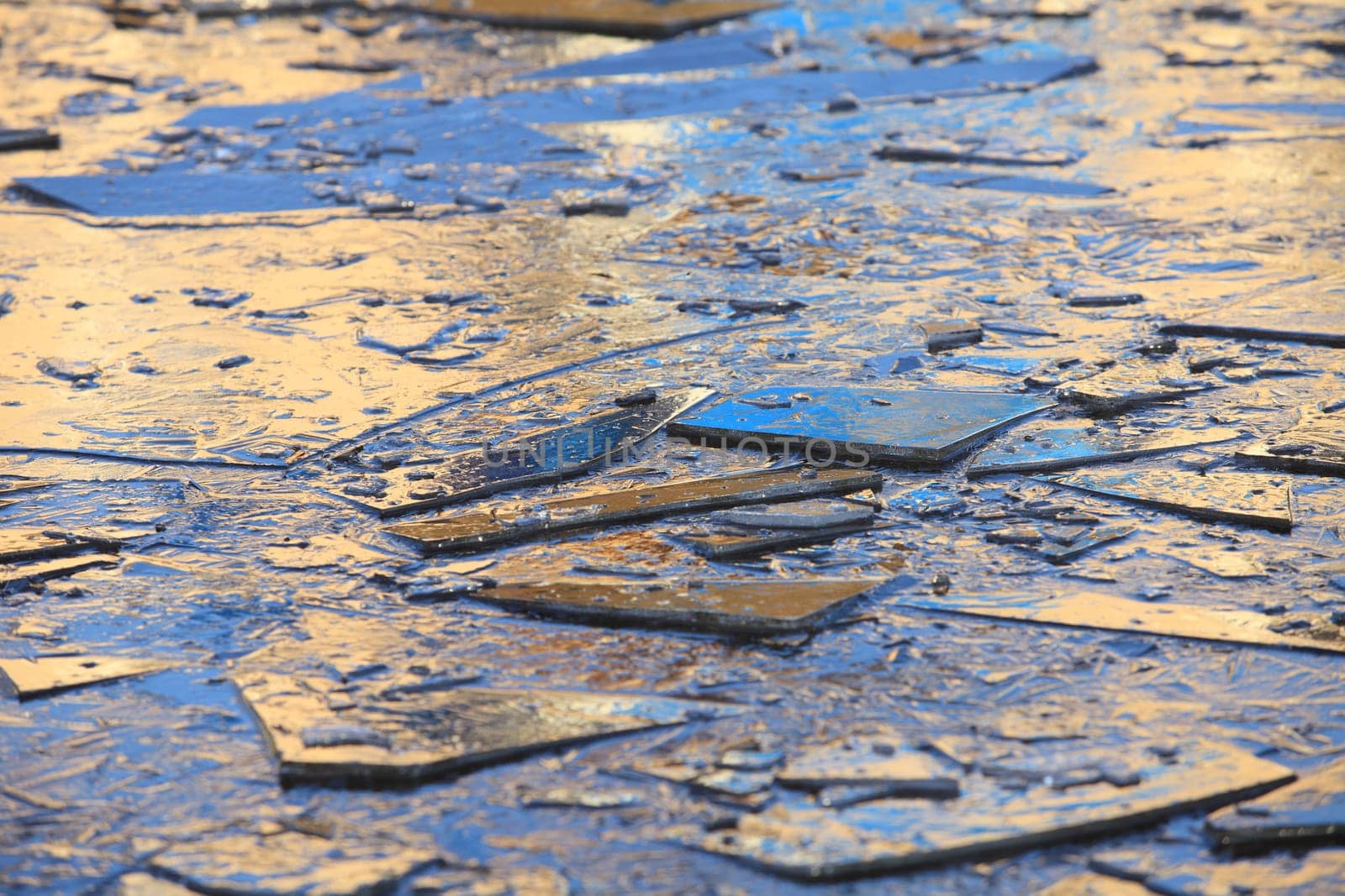 blue ice shards in the golden sunset, background