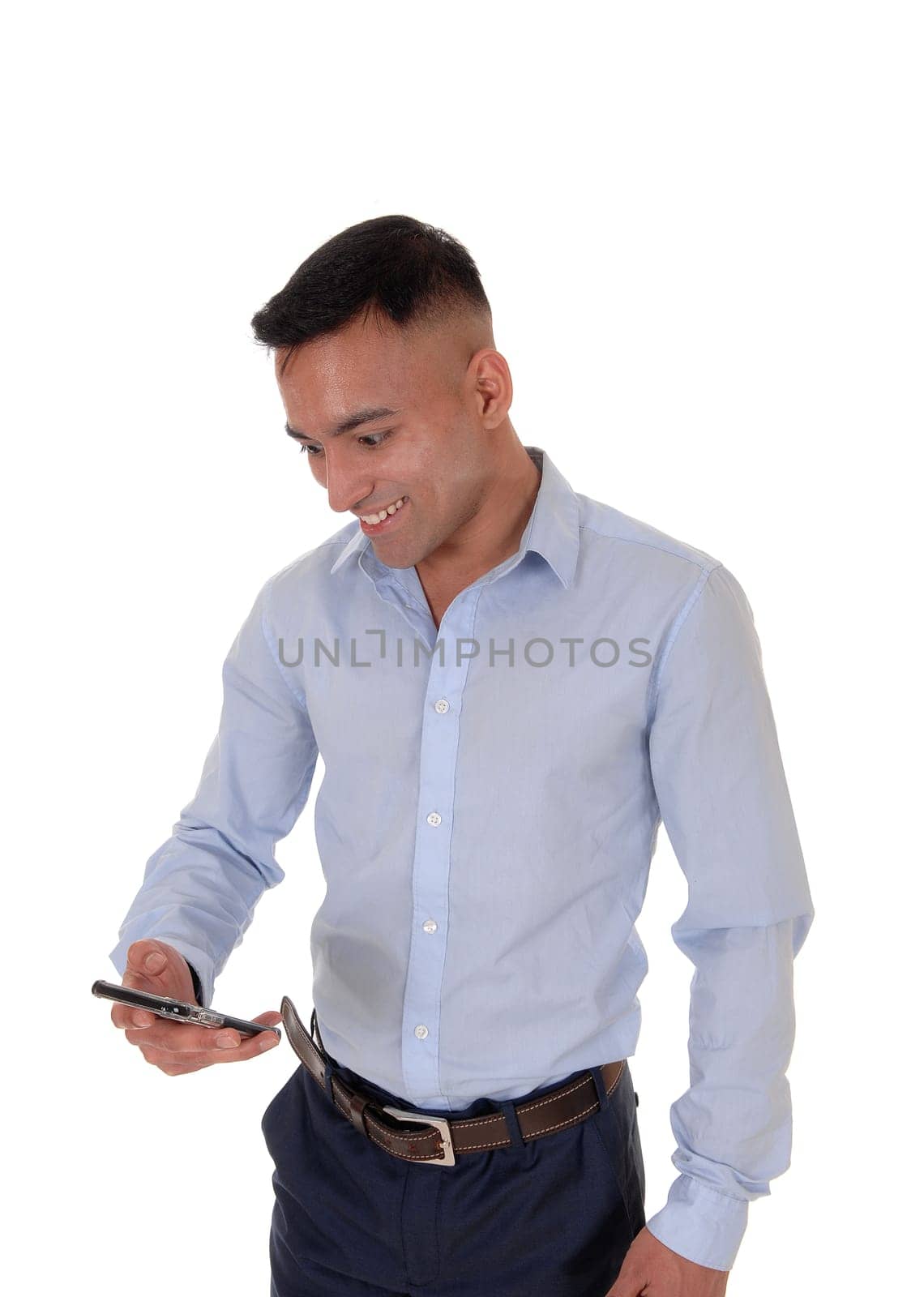 A young man is looking at his smart phone and is very happy about the.message he got, isolated for white background.