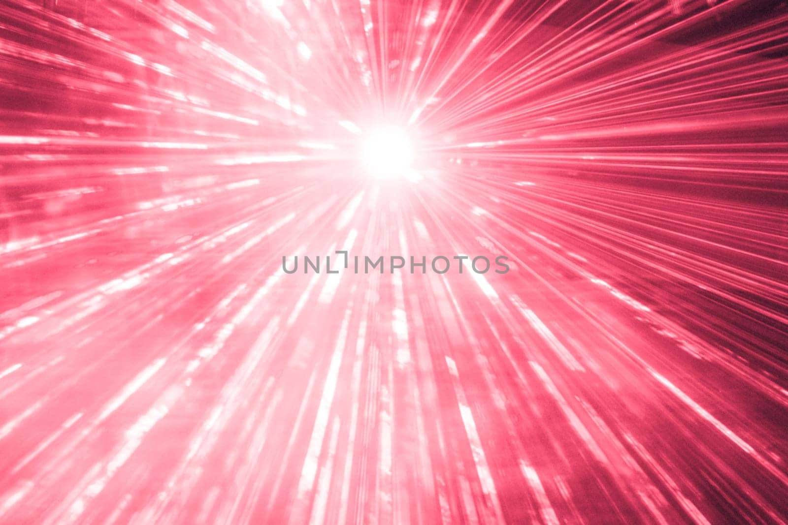 Luxury entertainment with bright light source and many beams and streams to every side at nightclub event, festival or New Year's Eve.