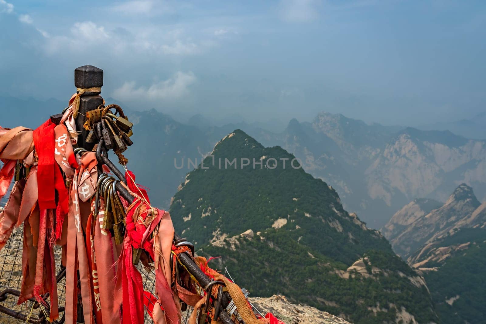 Huashan, China -  August 2019 : View of the stunning mountain landscape from the summit of West Peak on Huashan mountain, Xian, Shaanxi Province