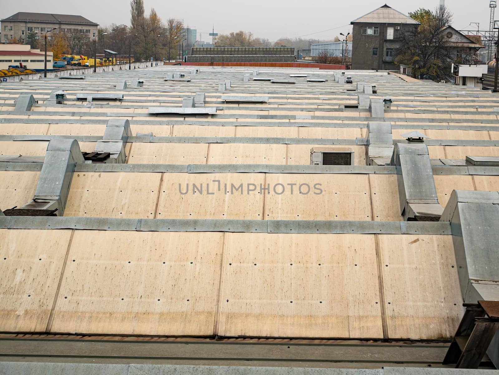 Roof of an industrial building with air ventilation pipes. Background image. Place for text.