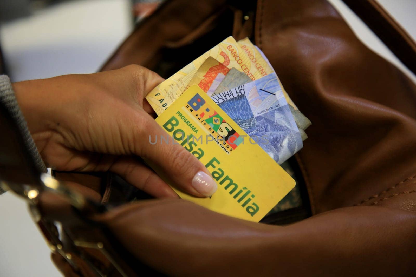 SALVADOR, BAHIA / BRAZIL - August 11, 2017: Family Allowance Card is seen as a user of the social benefit provided by the Federal Government of Brazil. (Joa Souza / Panthermedia).