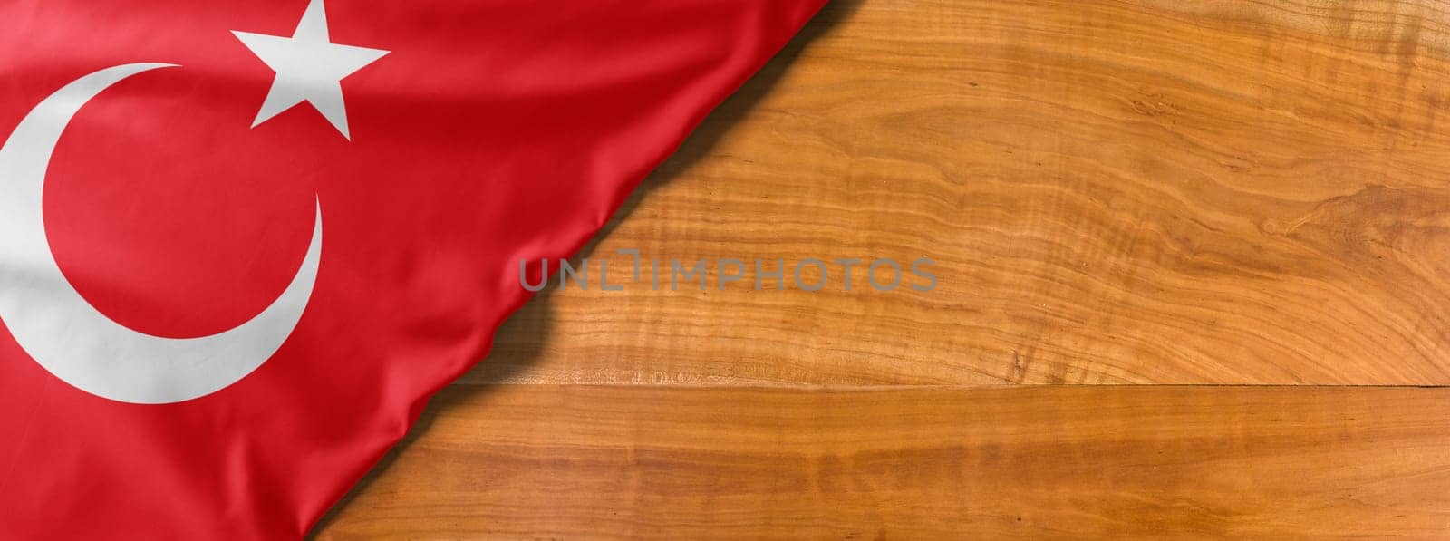 National flag of Turkey on a wooden background with copy space