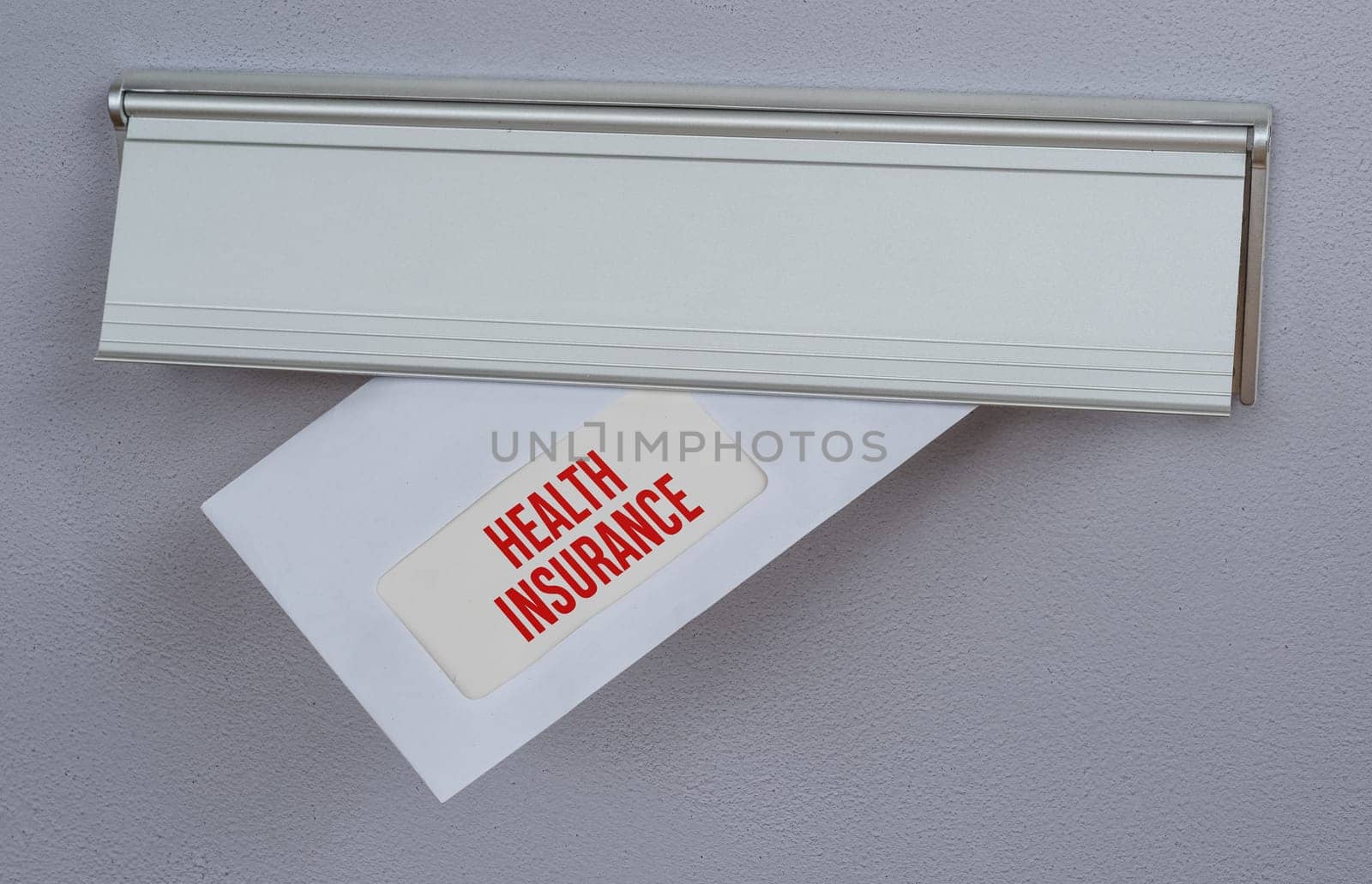 A letter in a mail slot - Health Insurance