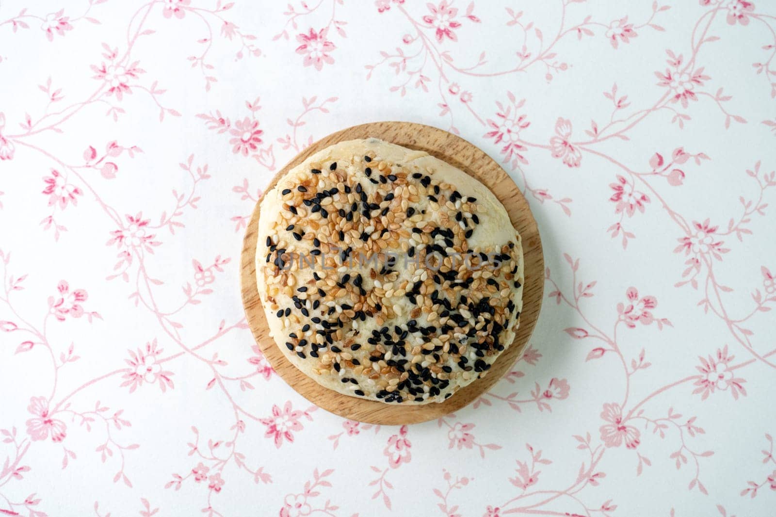 Chinese moon cake or pastry with sesame on top.