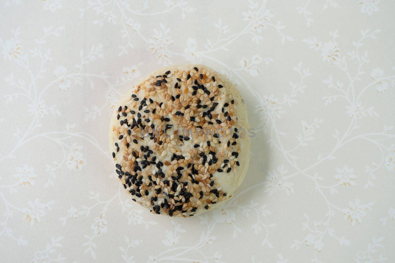 Chinese moon cake or pastry with sesame on top.