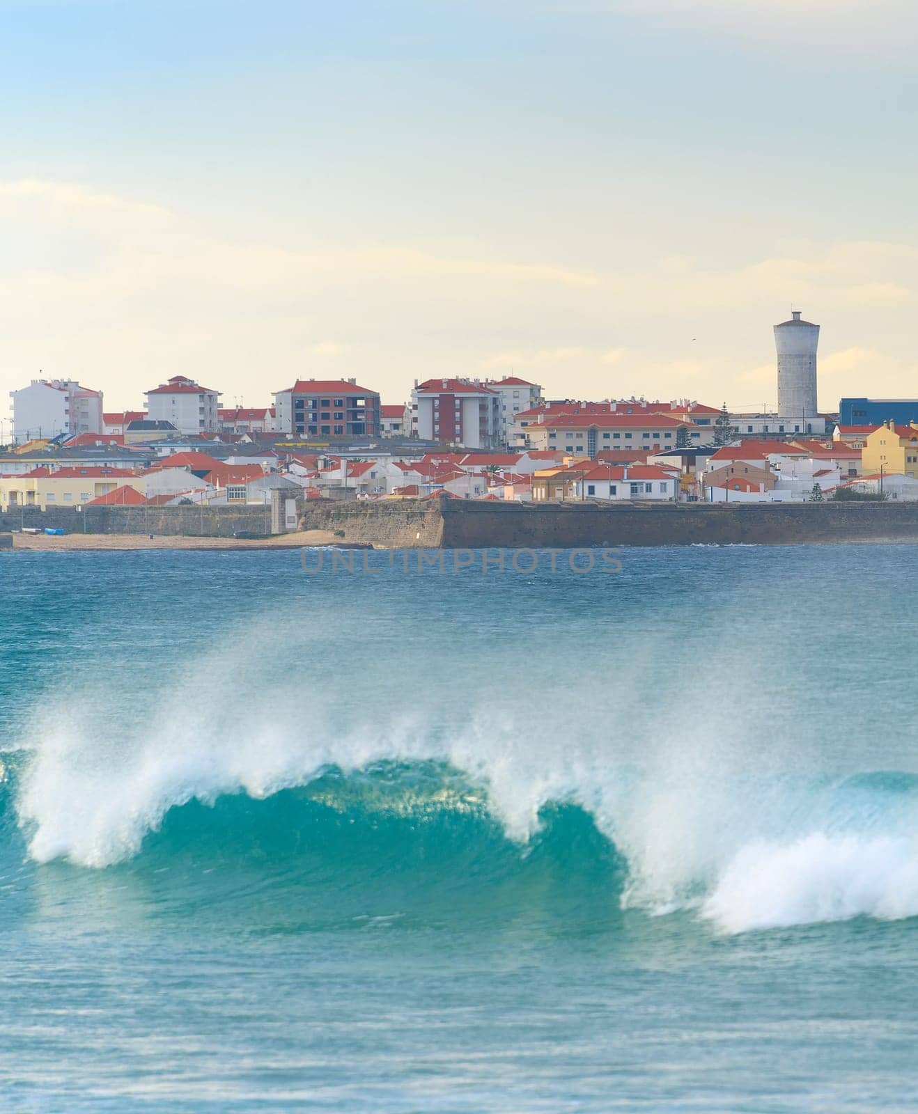 Cityscape of Peniche - coastal town in Portugal. Atlantic ocean in the foreground
