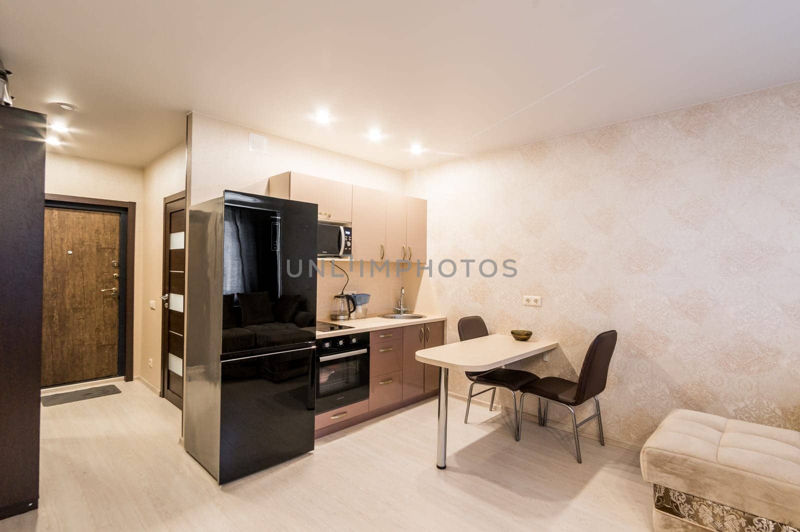 Russia, Moscow- June 26, 2019: interior room apartment. standard repair decoration in hostel. kitchen and dining room