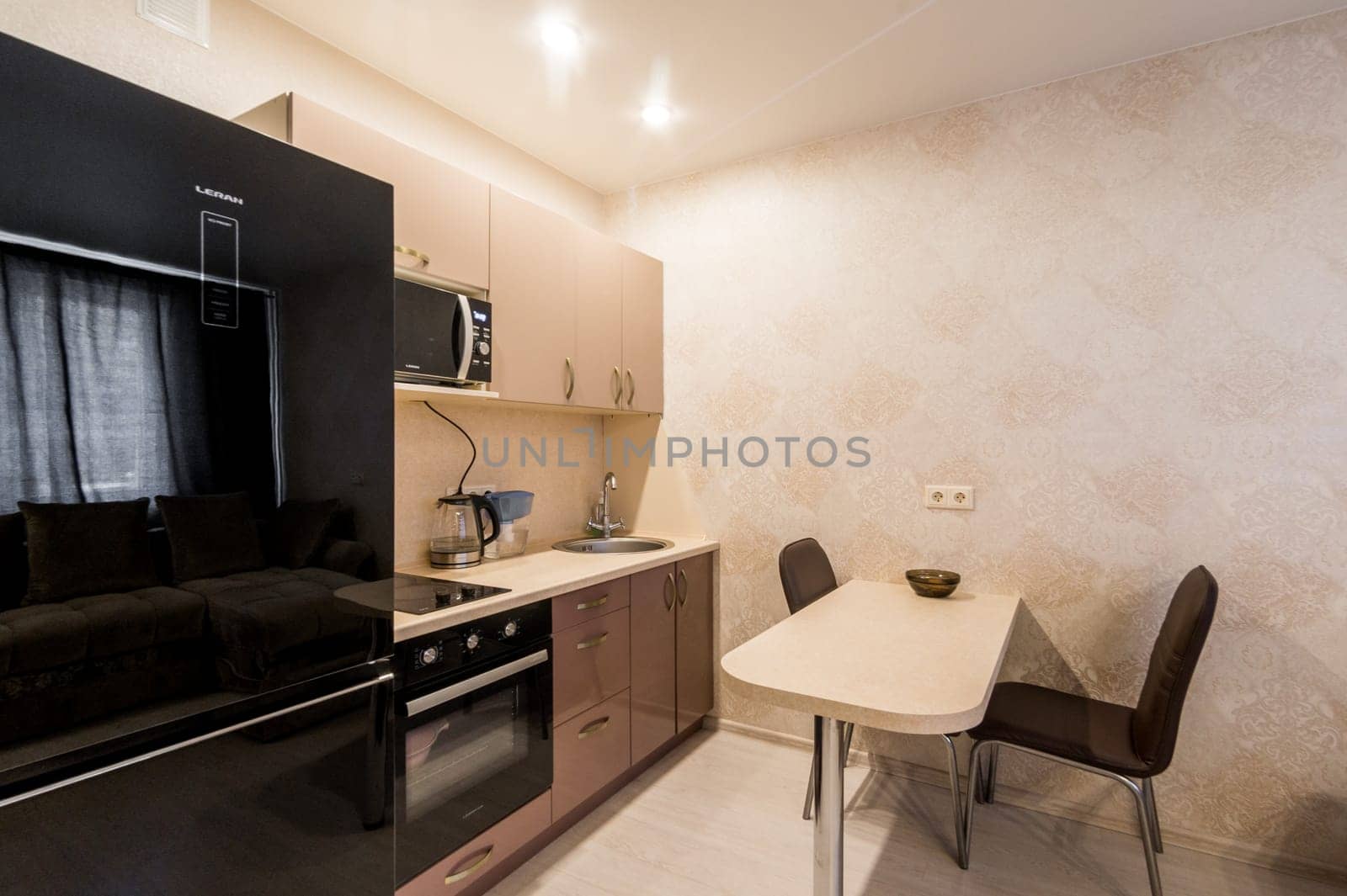 Russia, Moscow- June 26, 2019: interior room apartment. standard repair decoration in hostel. kitchen and dining room