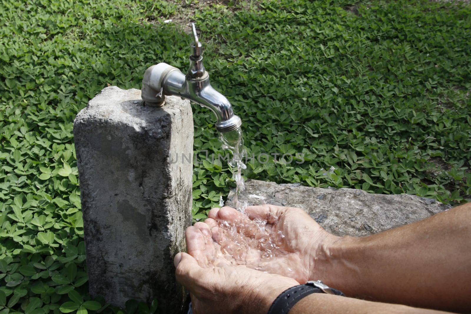 SALVADOR, BAHIA / BRAZIL - September 27, 2013: Faucet pours the last drops of water due to lack of supply.(Joa Souza)...