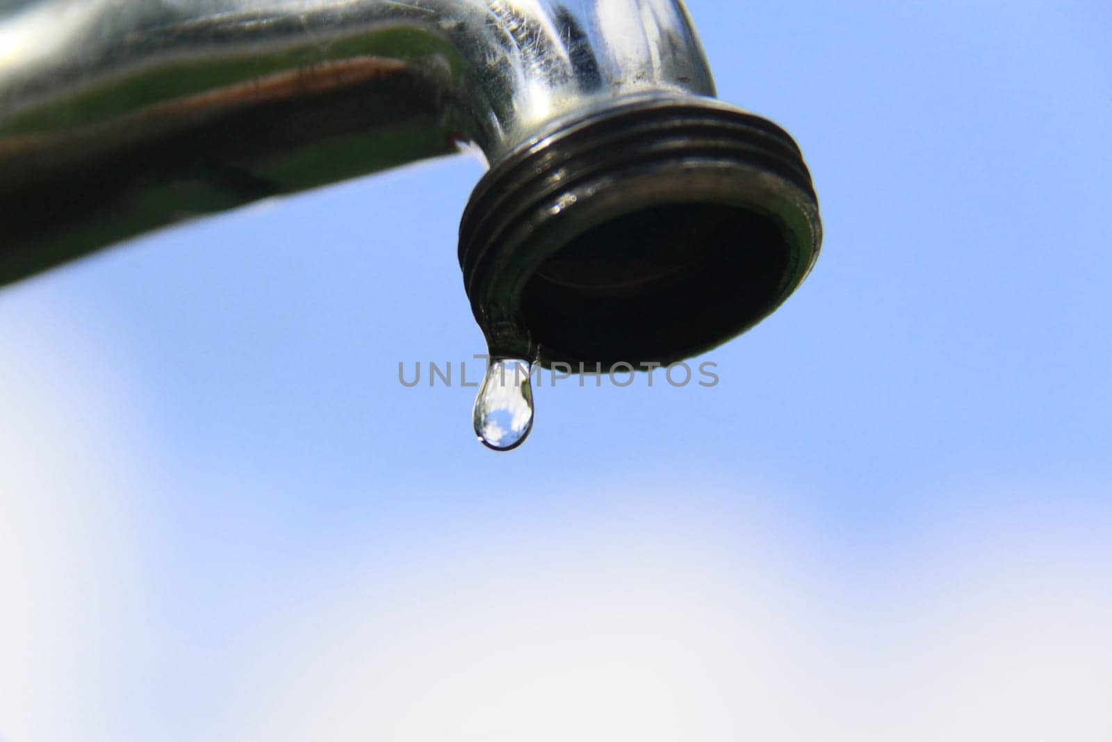 SALVADOR, BAHIA / BRAZIL - September 27, 2013: Faucet pours the last drops of water due to lack of supply.(Joa Souza)...