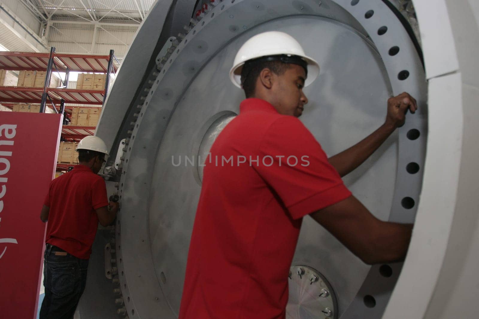 SIMOES FILHO, BAHIA / BRAZIL - May 13, 2015: Acciona Windpower wind turbine factory employees are seen working. (Joa Souza / Panthermedia).