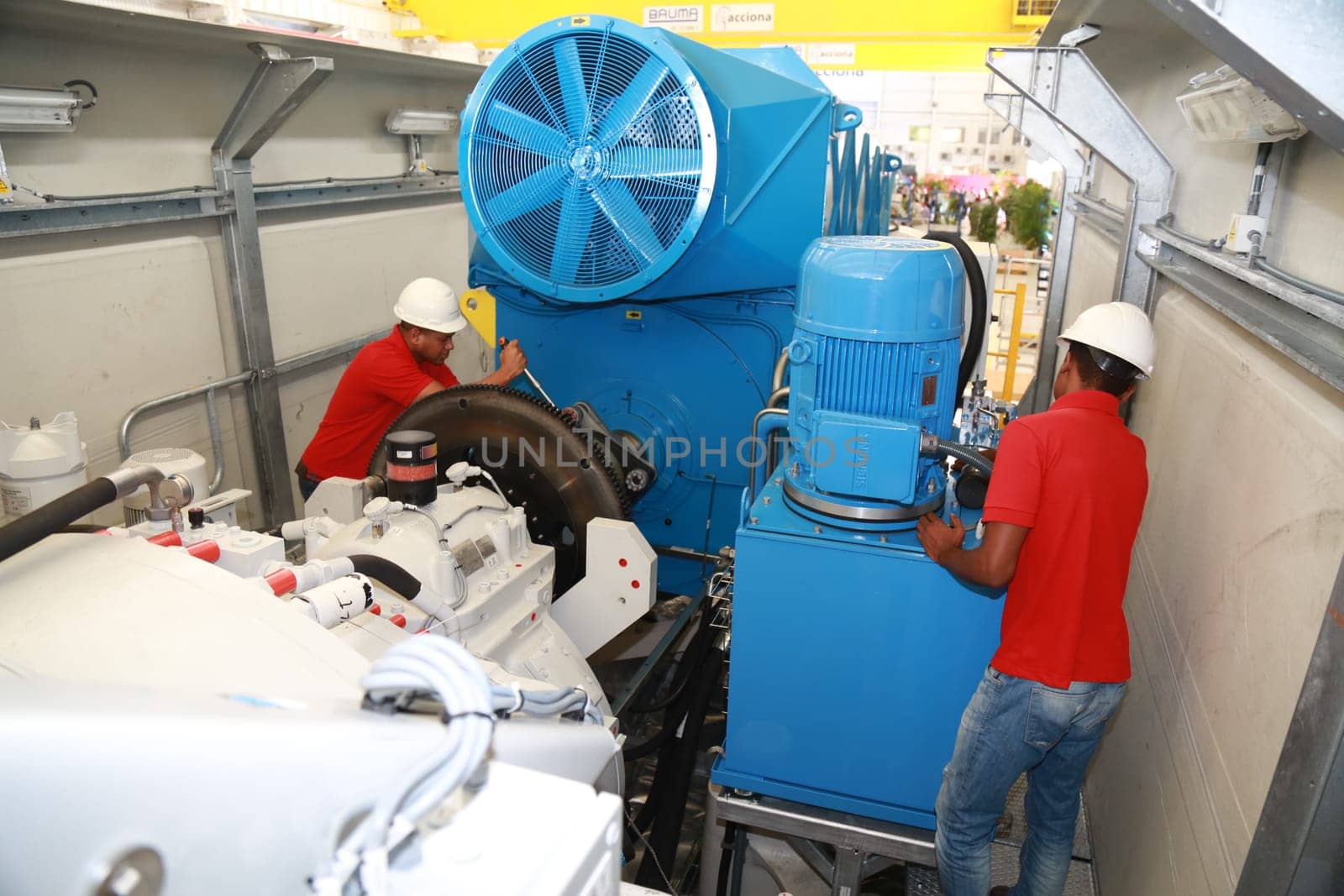 SIMOES FILHO, BAHIA / BRAZIL - May 13, 2015: Acciona Windpower wind turbine factory employees are seen working. (Joa Souza / Panthermedia).