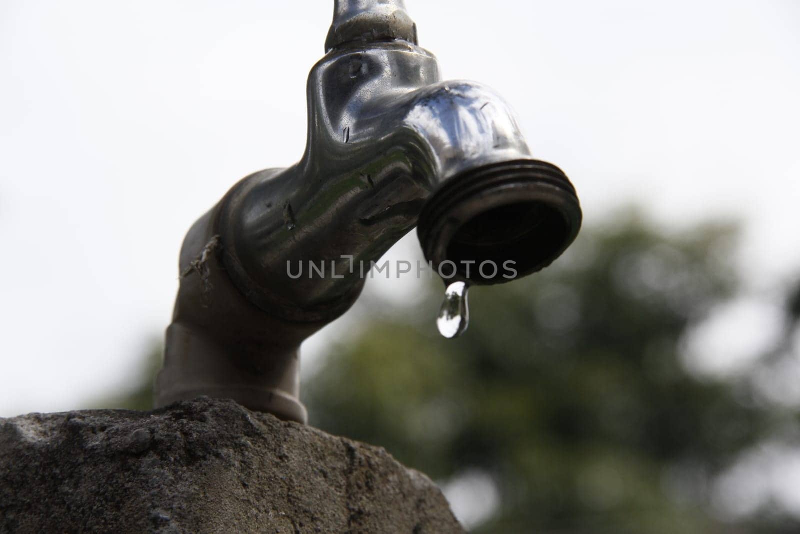 SALVADOR, BAHIA / BRAZIL - September 27, 2013: Faucet pours the last drops of water due to lack of supply.