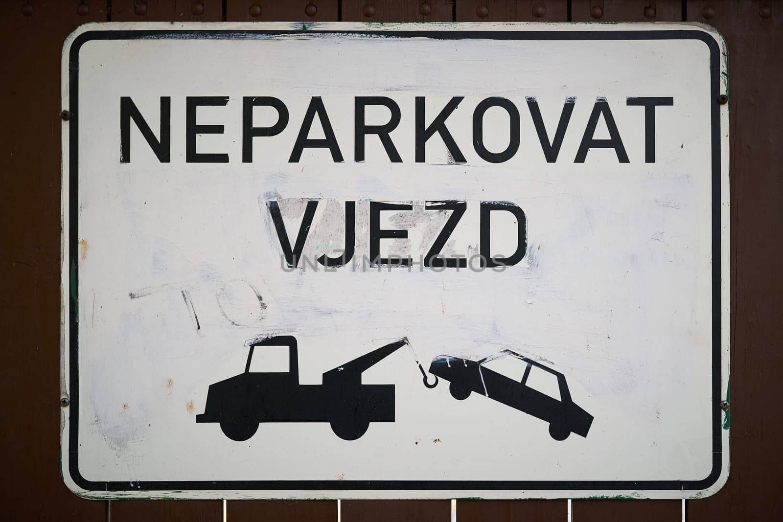 Sign with the inscription "Entrance, not parking"" at a garage door in Prague in the Czech Republic"