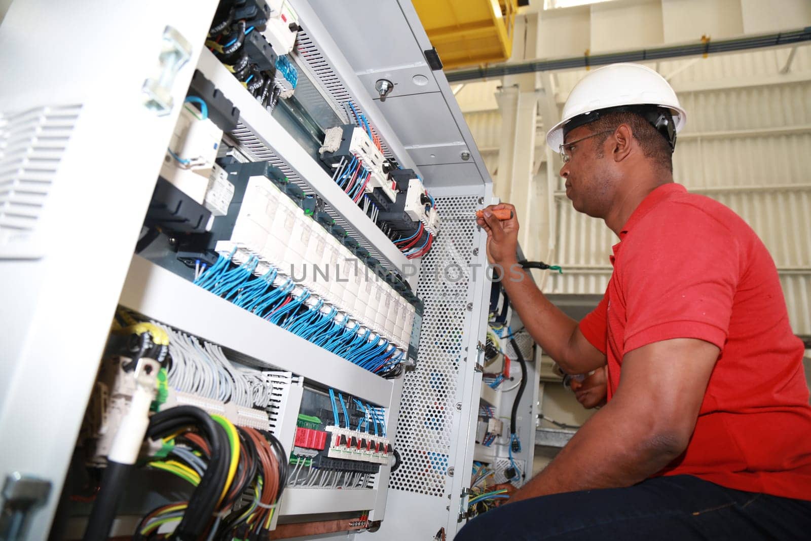 SIMOES FILHO, BAHIA / BRAZIL - May 13, 2015: Acciona Windpower wind turbine factory employees are seen working. (Joa Souza / Panthermedia).