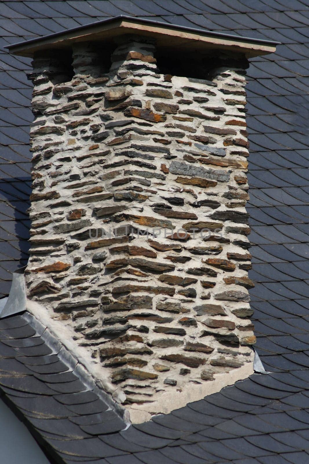 Beautiful brick chimney in stone