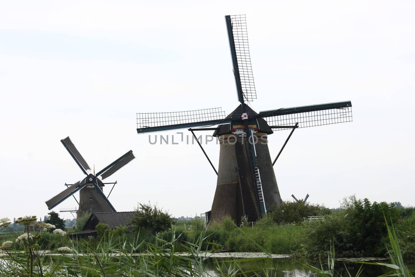 A beautiful, old, historic windmill, with four wings