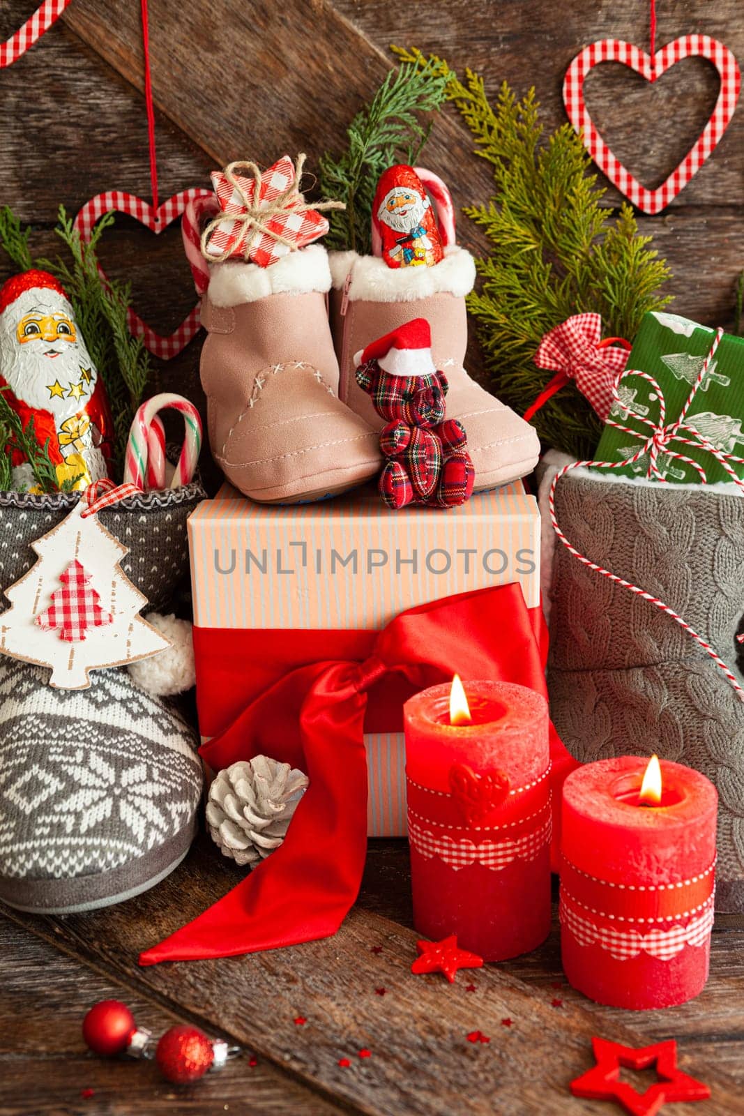 Knitted boots with little presents and candy for Christmas