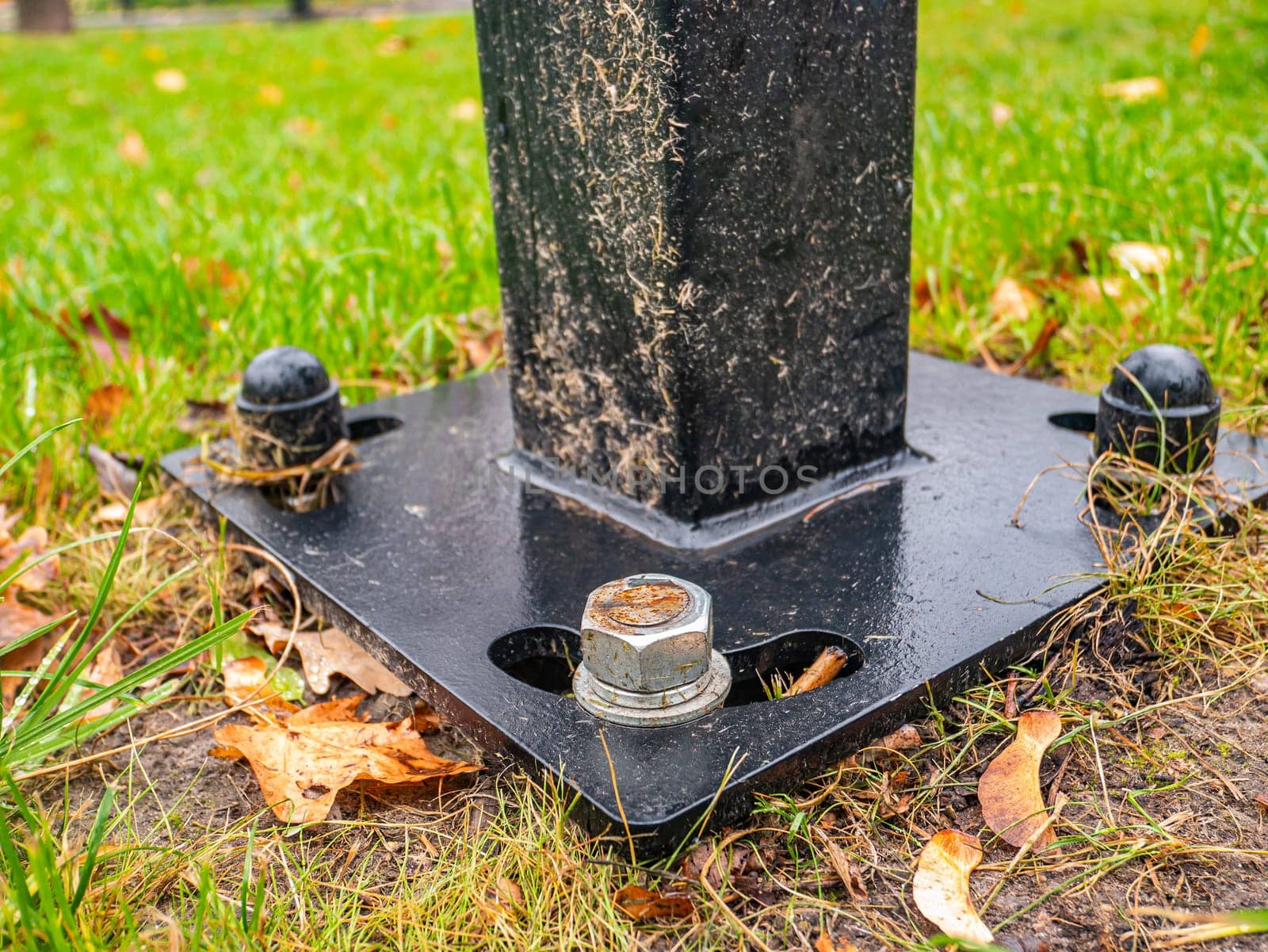 The nut is screwed onto the bolt. Street post mount. Place for text.