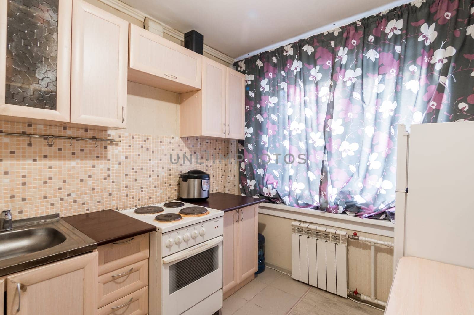 Russia, Moscow- July 02, 2019: interior room apartment. standard repair decoration in hostel. modern kitchen, dining area
