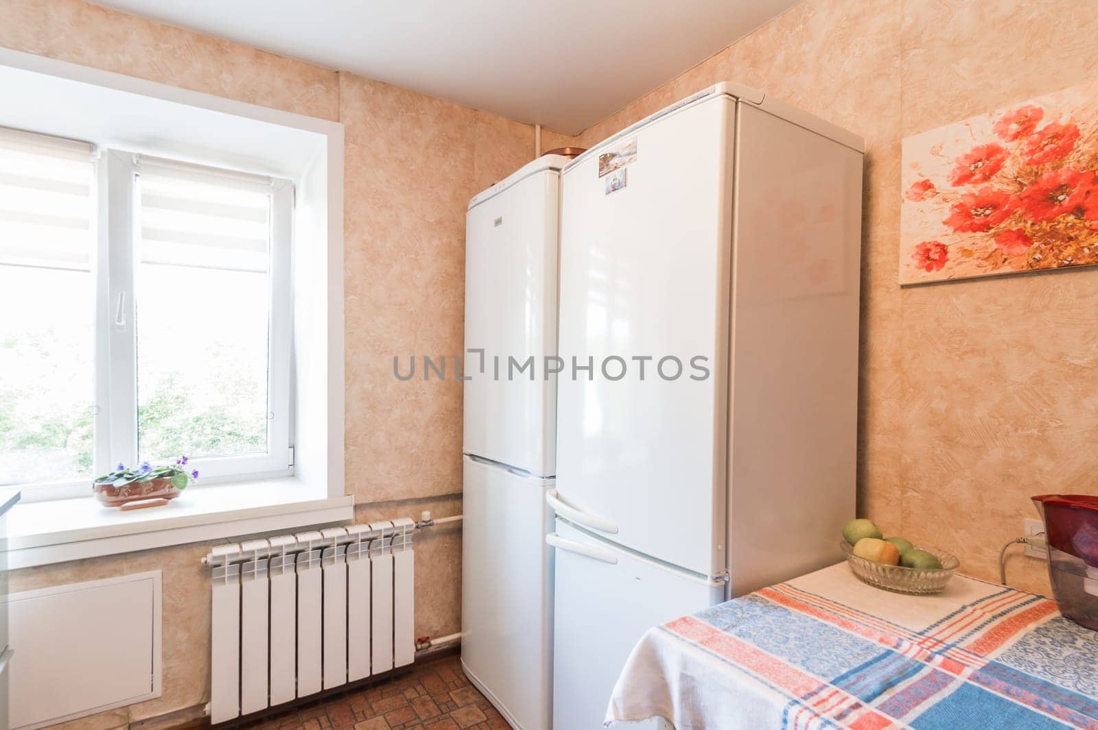 Russia, Moscow- July 01, 2019: interior room apartment. standard repair decoration in hostel. modern kitchen, dining area
