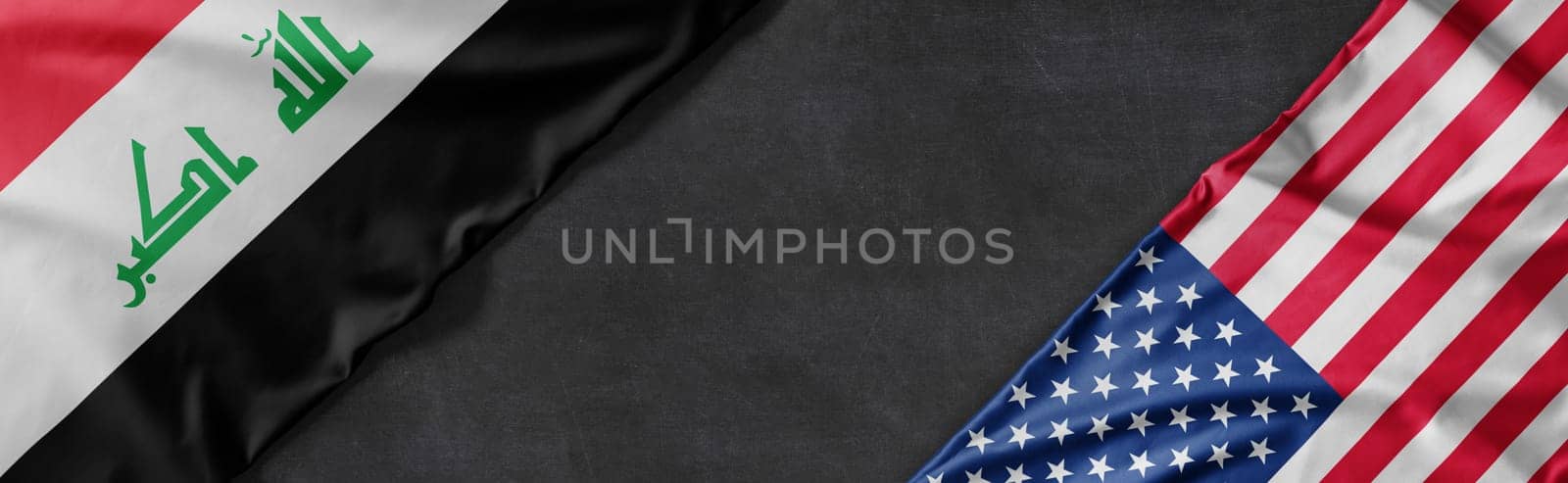 Flags of Iraq and the United States of America with copy space