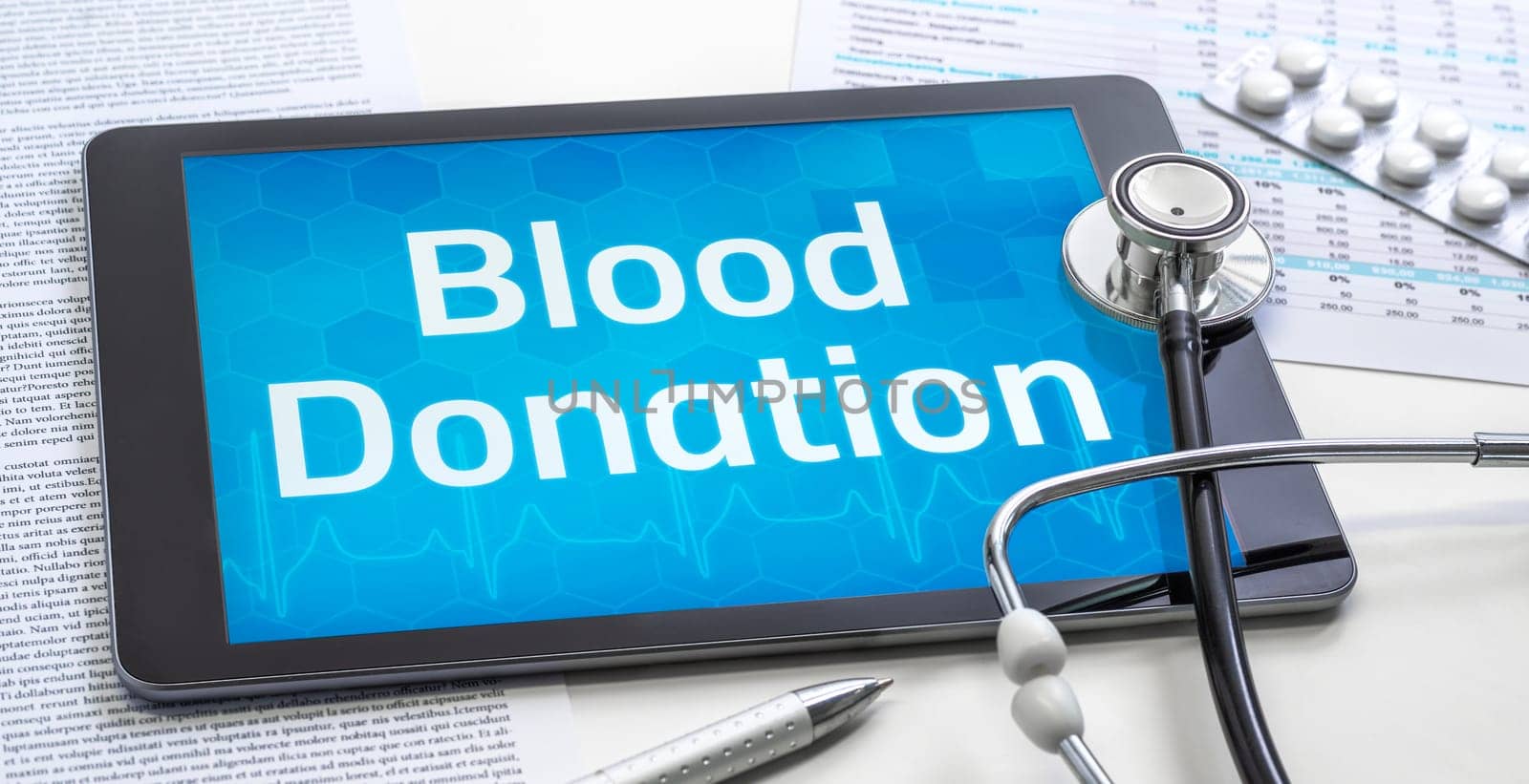 The word Blood Donation on the display of a tablet