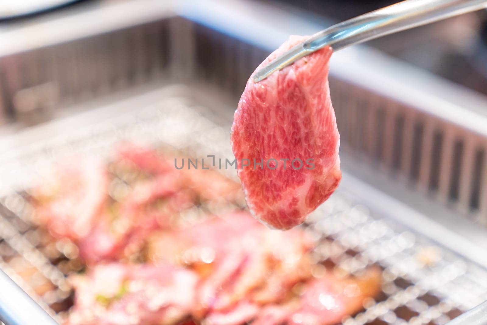 grilled japanese wagyu premium beef yakiniku with red hot charcoal