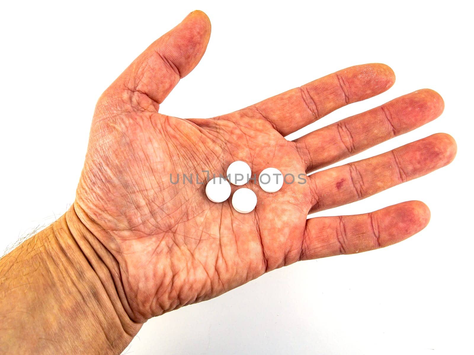 Medical pills in hand on a white background. Place for text. Medicine and health.