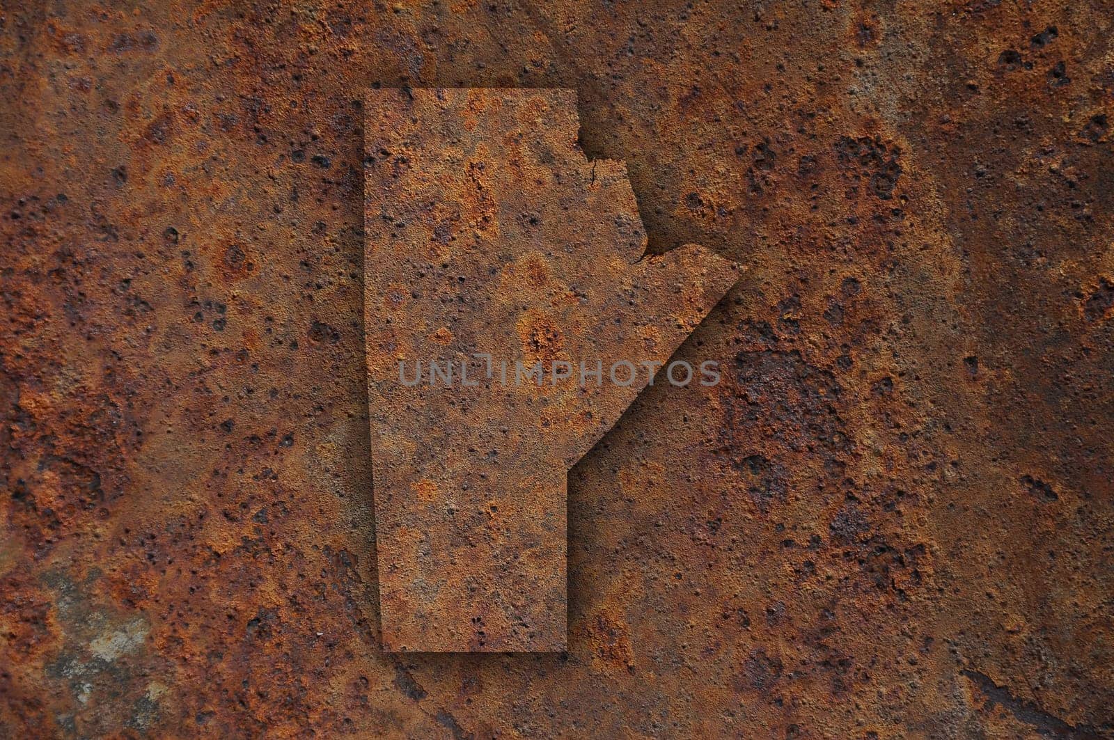 Map of Manitoba on rusty metal