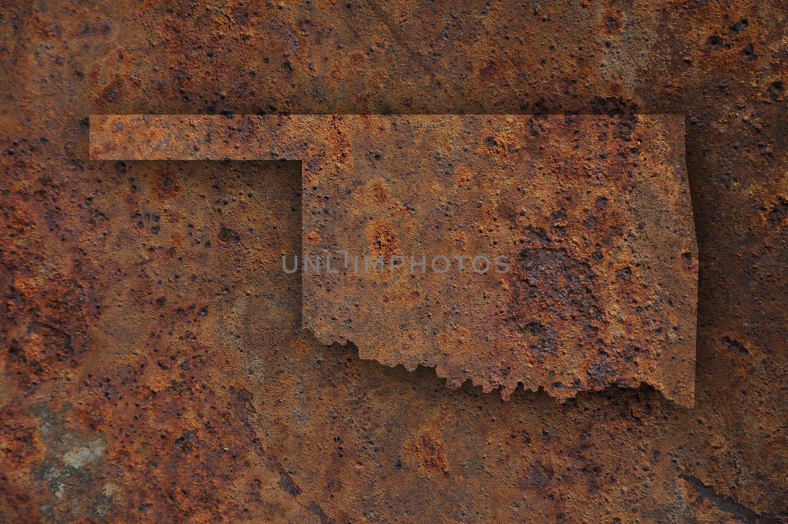 Map of Oklahoma on rusty metal