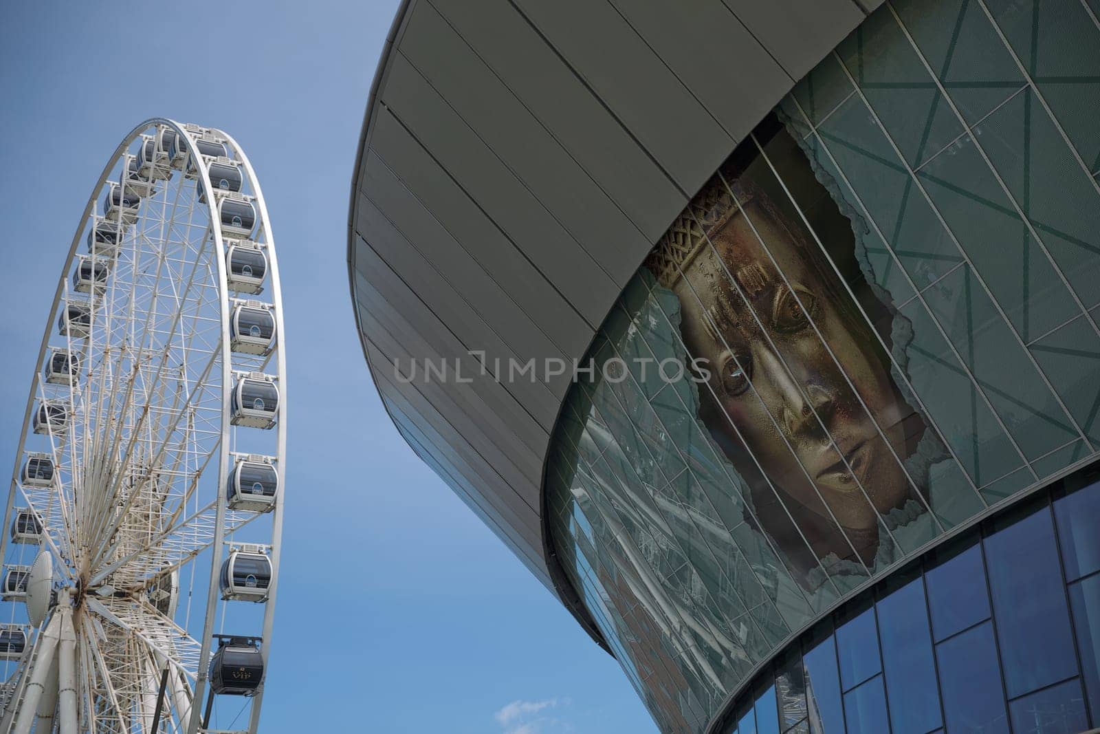 LIVERPOOL, ENGLAND, UK - JUNE 07, 2017: View of the ECHO convention center and an adjacent ferris wheel in Liverpool, England