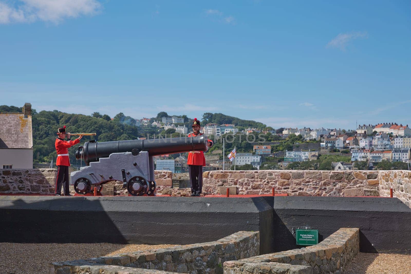 ST. PETER PORT, GUERNSEY, UK - AUGUST 16, 2017: Guards Firing The Noon Day Gun At Castle Cornet, St. Peter Port, Guernsey, Channel Islands.