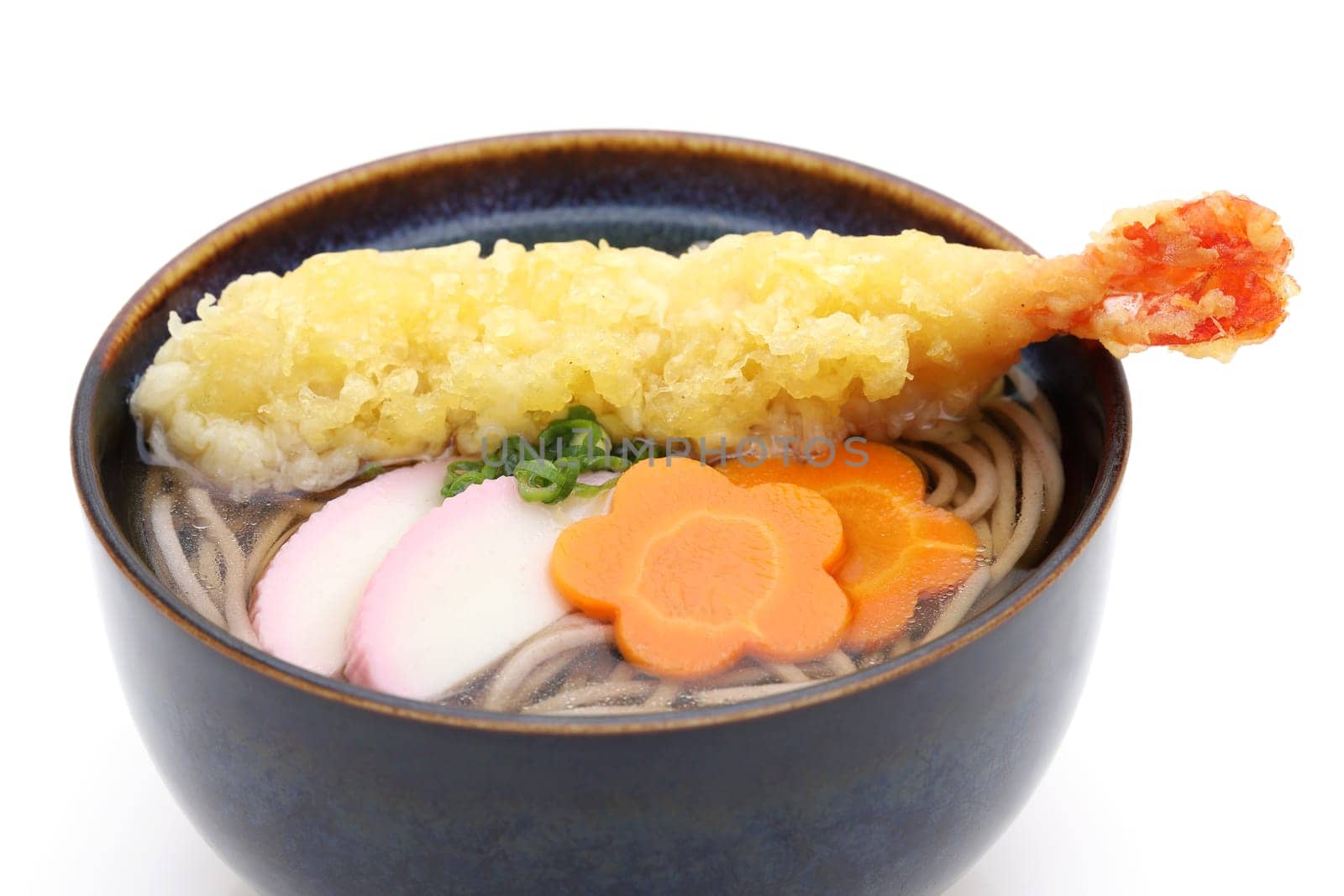 Japanese Tenpura soba noodles in a bowl on white background