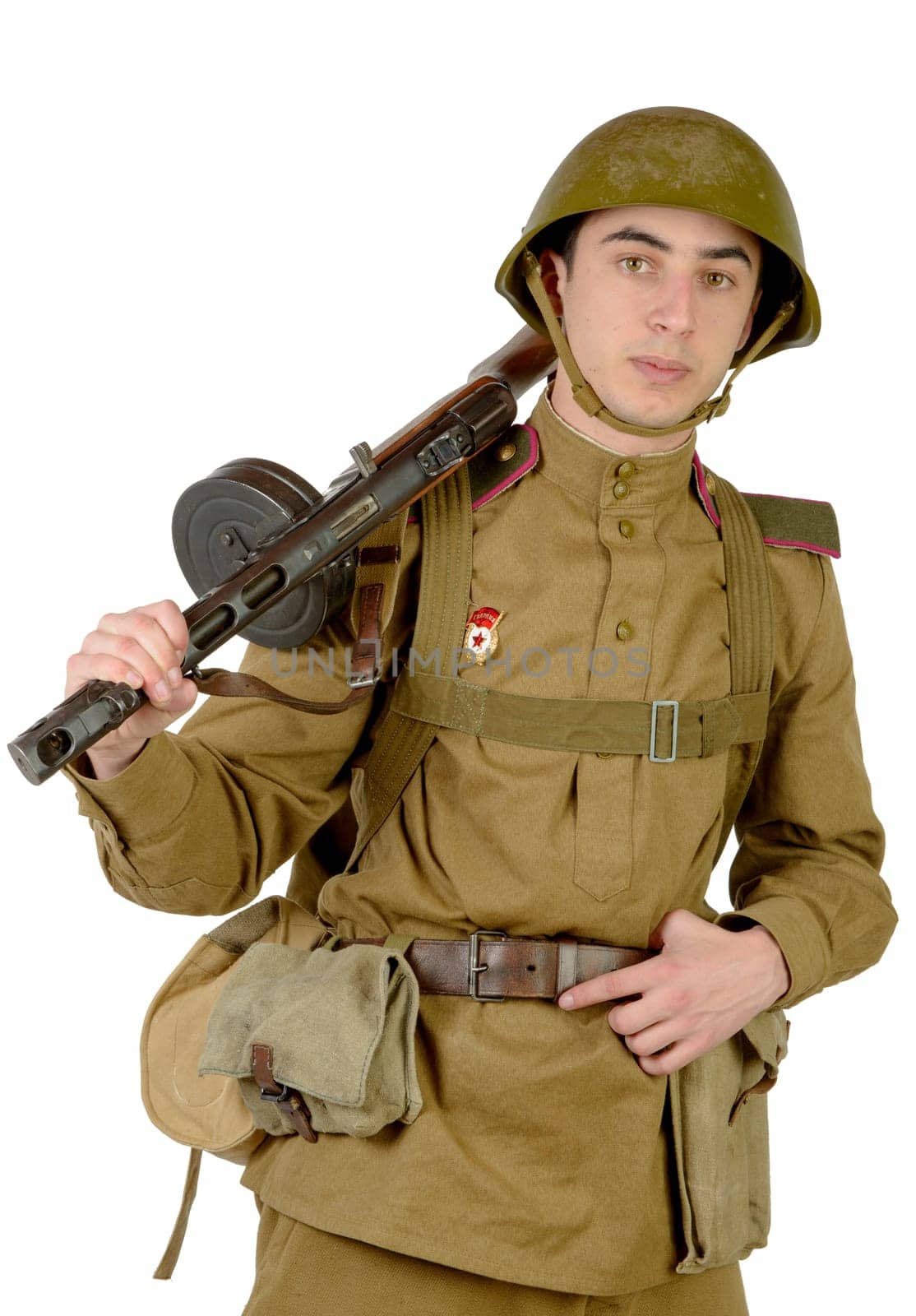 young Soviet soldier with machine gun on the white background