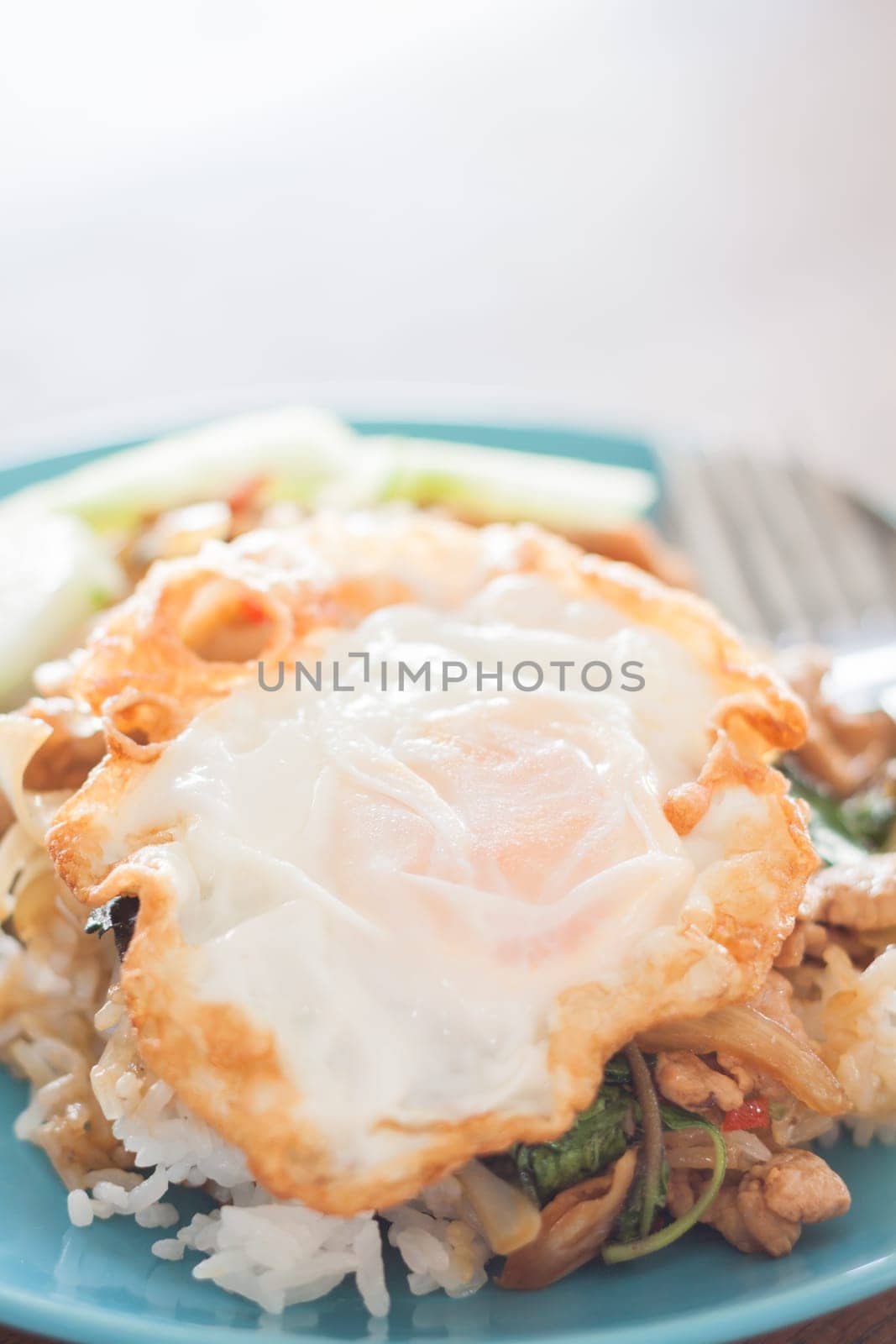 Basil fried rice with pork and fried egg, stock photo