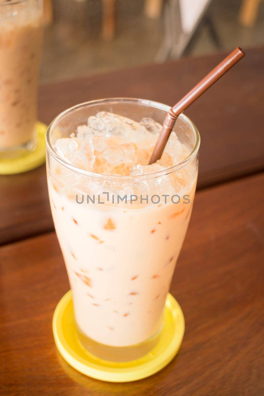 Glass of iced thai milk tea, stock photo