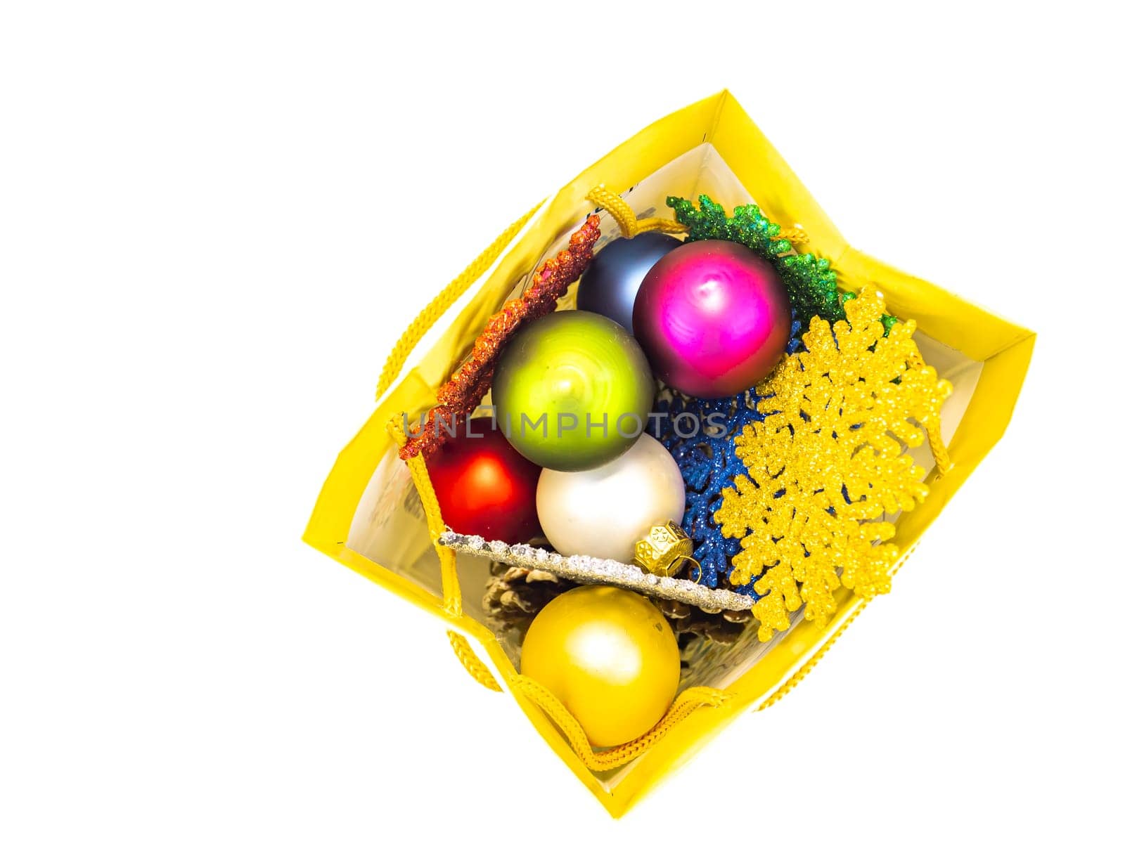 Christmas present from Christmas toys on a white background with place for text. New Year's holidays. Background image. Free space for text.