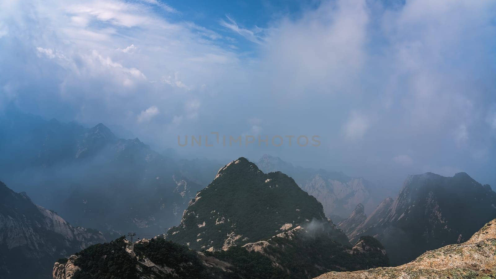 Panoramic view from the West Peak summit of the inspiring, sacred and majestic Huashan mountain, famous tourist attraction, Shaanxi province, China