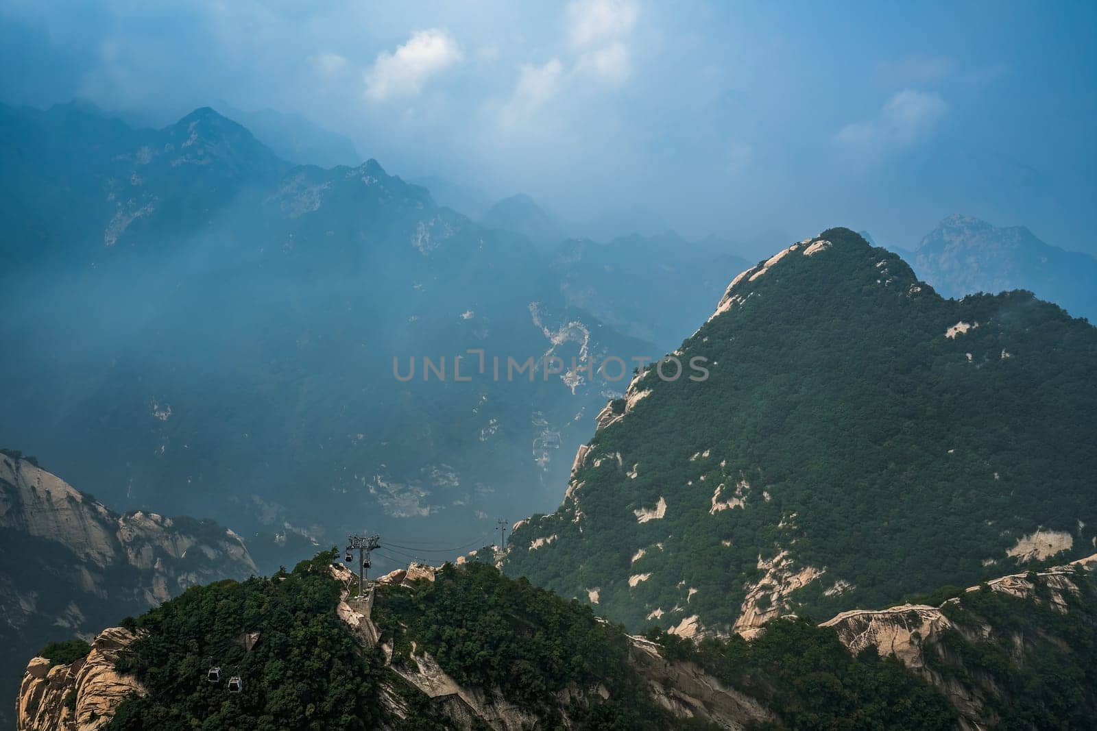 Panoramic view from the West Peak summit of the inspiring, sacred and majestic Huashan mountain, famous tourist attraction, Shaanxi province, China
